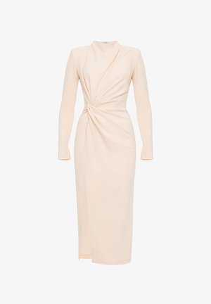 Długa rękawowa sukienka w kolorze kremowym, uszyta z gładkiego materiału, z skręconym wzorem w talii i wysokim dekoltem. Midi z rozcięciem po bokach.