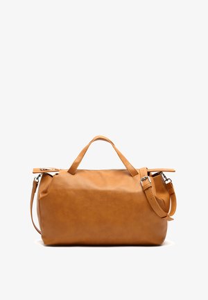 Tan leather duffel bag with two top handles and an adjustable shoulder strap. Smooth texture, rounded shape, and zip closure.