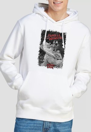 White hoodie with front graphic of a woman in a flowing dress dancing, text in red reading "La Famille et un Monstre" and "Interview Vampire."