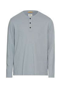 Langärmliges Henley-Shirt in Hellblau mit einem runden Halsausschnitt, dreiknöpfiger Blende und kleinem Logo auf der Brust. Weicher Stoff.