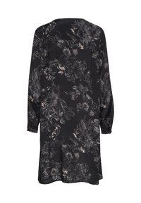 Schwarzes Kleid mit einem floralen Muster in Grau und Beige. Es hat lange Ärmel und eine lockere Passform und besteht aus einem weichen, leichten Stoff.
