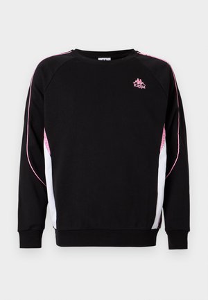 Črno dolgo majico s pikami roza obrobe in mrežastimi poudarki, belimi stranskimi paneli ter majhnim roza logotipom Kappa na prsih.