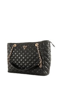 Borsa a tracolla nera trapuntata con catene dorate e manico in pelle. Presenta un accento con logo triangolare e una superficie texture.