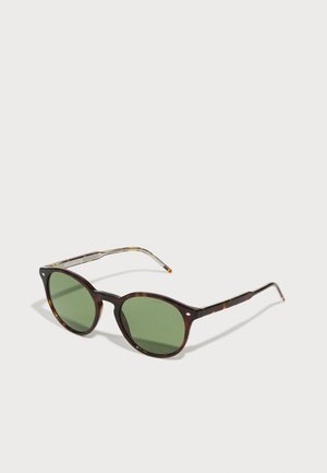 Brown tortoiseshell sunglasses with green lenses, round shape, and thin arms featuring patterned accents. Solid design with subtle detailing.