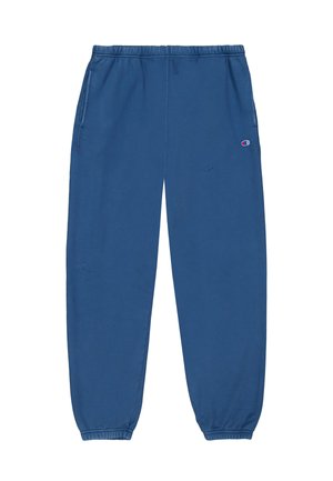 Blue sweatpants made of soft fabric, featuring an elastic waistband, two side pockets, ribbed cuffs, and a small logo on the left thigh.