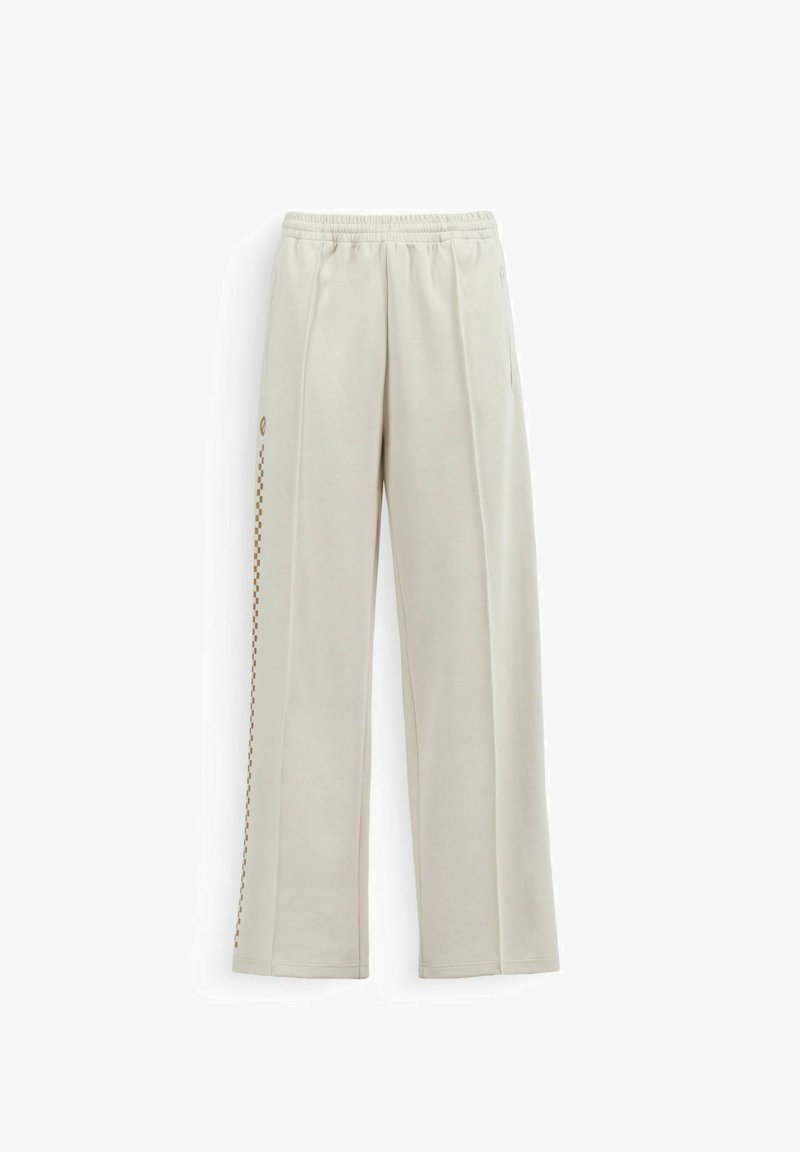 Pantalon beige à jambes droites avec taille élastique et fine rayure à carreaux marron discrète sur le côté gauche.