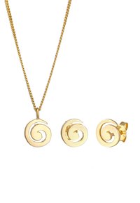 Guldtonet smykkesæt bestående af en spiralvedhængsnekæde og matchende spiralstudøreringe. Glat, skinnende finish med indviklede design detaljer.