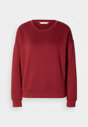 Sweatshirt rouge à col rond, avec un design à épaules raglan, des poignets et un ourlet côtelés. Fabriqué en tissu doux et lisse avec une couleur unie et simple.