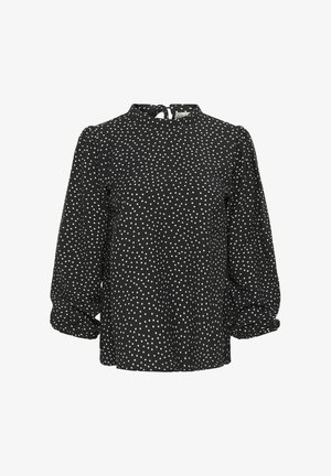 Black blouse with white polka dots, high neck, balloon sleeves, and a tie closure at the back. Soft fabric with a textured appearance.