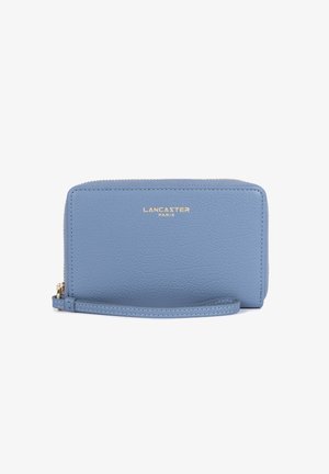 Light blue leather wallet with a textured finish, gold branding, zip closure, and wrist strap. Compact rectangular shape with stitched accents.