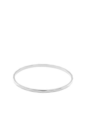 Thin silver bangle bracelet with a smooth, slightly irregular surface and a polished finish on a white background.