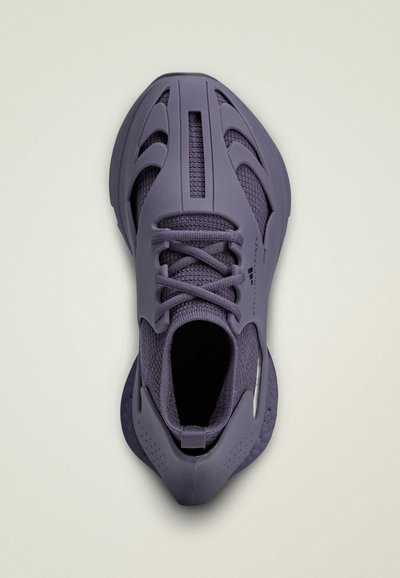 Purple athletic shoe featuring a textured mesh upper, exposed structural elements, and lacing system, with a molded heel and ankle support.