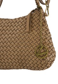 Brown woven leather handbag with a gold circular Venice logo charm hanging from a chain near the strap attachment.