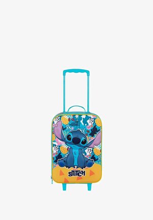 Valise rigide bleue et jaune avec un motif du personnage Stitch. Équipée d'une poignée télescopique, de roues et d'accents à motif tropical.