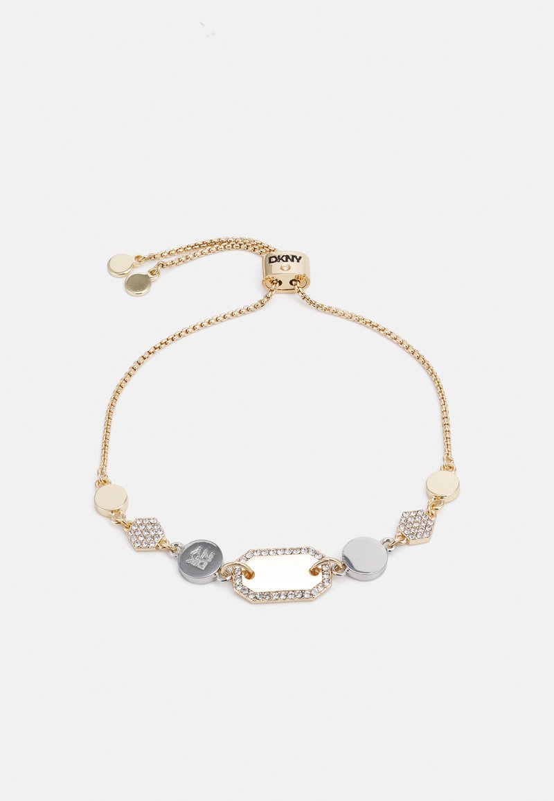 Bracciale in tono oro con forme interconnesse, tra cui esagoni e cerchi, arricchito da accenti in argento e strass incastonati. Chiusura regolabile.