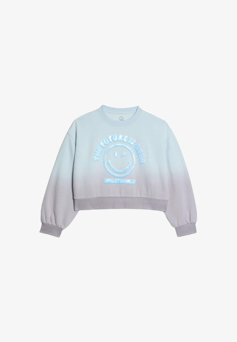 Felpa corta azzurro chiaro con una sfumatura verso il grigio, caratterizzata da una grafica di un volto sorridente e la scritta "IL FUTURO È QUI" in blu. Tessuto morbido.