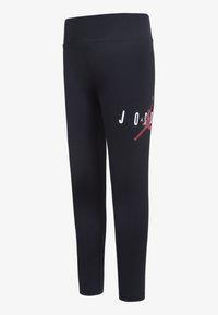 Leggings neri realizzati in tessuto elasticizzato, con un logo grafico bianco e rosso sulla gamba sinistra. Texture liscia e design aderente.