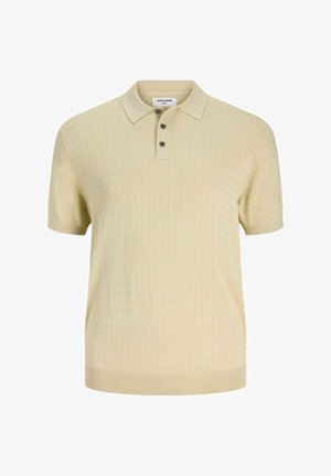 Μπεζ πόλο με κοντά μανίκια, διακριτικό τετράγωνο μοτίβο, πατιλέτα με τρία κουμπιά και εφαρμοστό γιακά.