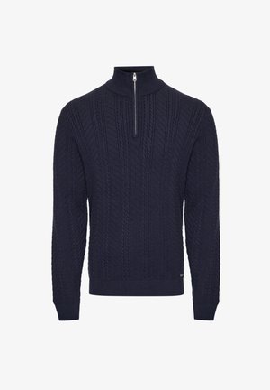 Pull en maille bleu marine avec un col zippé demi, présentant des motifs en câble texturés et des poignets et ourlet côtelés pour un look ajusté.