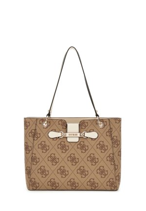 Beige and brown Guess tote bag with monogram pattern, two black shoulder straps, and a front buckle detail with the brand name.