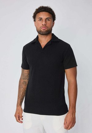 COL V À REVERS - Polo - noir