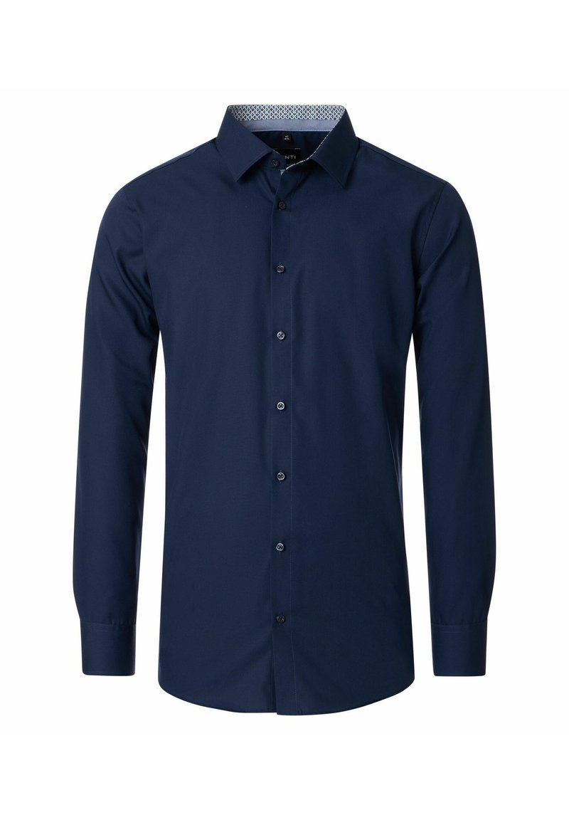 Marineblauwe longsleeve shirt van katoen. Beschikt over een volledige knoopsluiting aan de voorkant, een standaard kraag en een contrasterende gemusterde voering in de kraag.