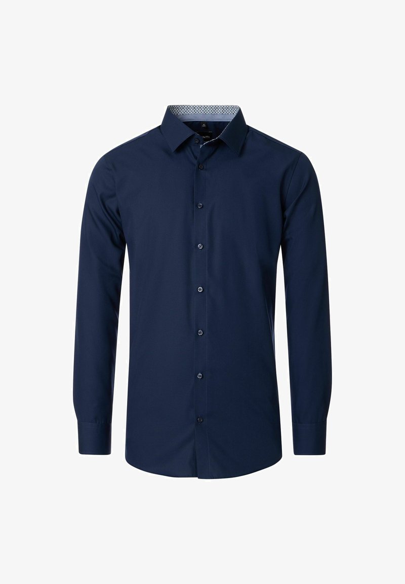 Marineblauwe longsleeve shirt van katoen. Beschikt over een volledige knoopsluiting aan de voorkant, een standaard kraag en een contrasterende gemusterde voering in de kraag.