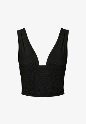 Top corto negro sin mangas con escote en V profundo y banda elástica texturizada en la parte inferior.