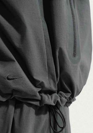 Nike Sportswear, M NK DF TCH WVN WR FZ JKT - Lichte jas - black black black