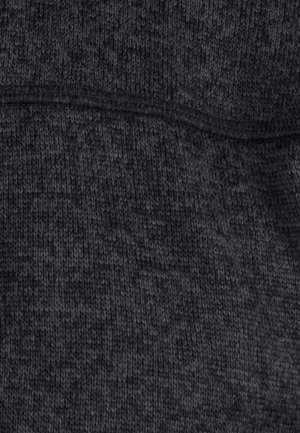 Donkergrijze brei-stof met een gestructureerd oppervlak en een subtiel patroon. Naaddetails zijn zichtbaar en tonen een zachte, comfortabele textuur.