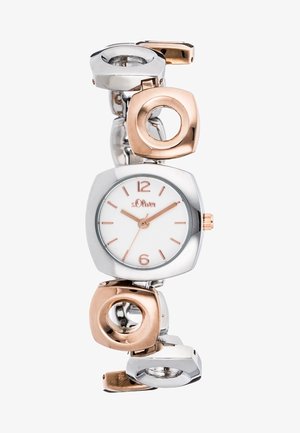 Montre bracelet en métal argenté et or rose avec cadran rond blanc, index et aiguilles en or rose, et maillons circulaires décoratifs.