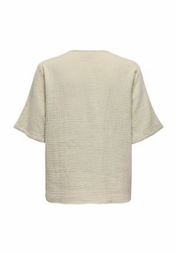 Lys beige, struktureret stof bluse med korte ærmer, der har en løs pasform og firkantet form. Bagsiden har en rund udskæring.