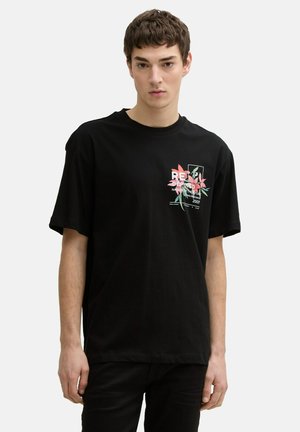Black short-sleeve T-shirt with relaxed fit, featuring a colorful graphic print on the front, highlighting floral patterns and text.
