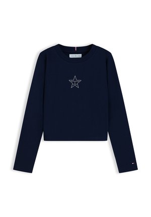 Maglietta corta a maniche lunghe blu navy con una stella borchiata sul petto e un piccolo logo sul polsino della manica sinistra.