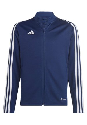 Marineblauwe zip-up jack van een gladde stof, met witte strepen op de mouwen en een Adidas-logo aan de linkerkant van de borst.