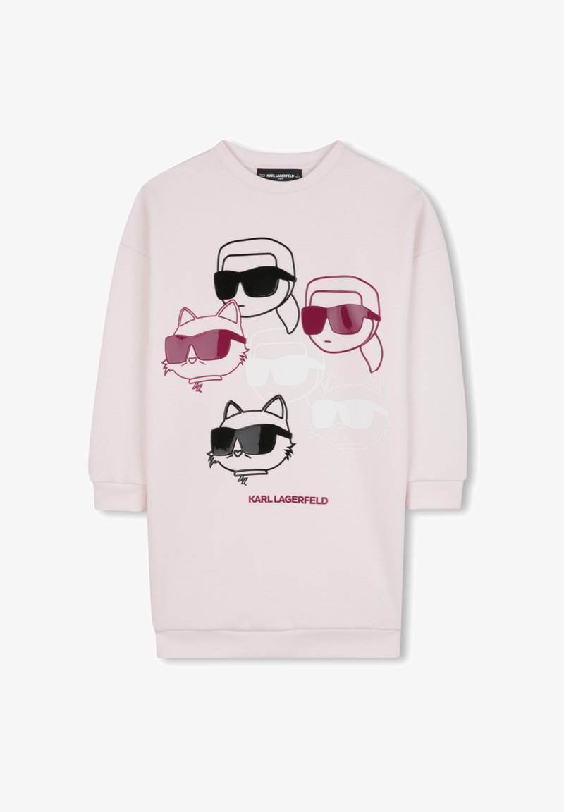 Sweatshirt rose présentant des designs graphiques de personnages stylisés et d'un chat portant des lunettes de soleil. Inclut des accents noirs et bourgognes. Tissu doux.