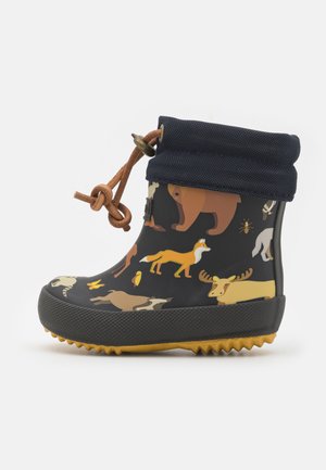 Rubber rain boot features a dark blue body with colorful animal prints, a textured black sole, and a foldable navy fabric cuff with brown lacing.