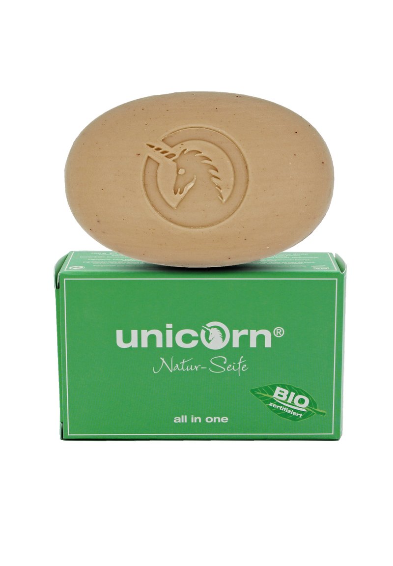Biodegradable soap in oval brown bar with a unicorn logo. Packed in a green box labeled "unicorn Natur-Seife" with a BIO certification.