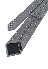 Cravatta grigia con un motivo a pois caratterizzata da piccoli punti rossi e bianchi. Realizzata in tessuto, presenta un'etichetta con la scritta "HACKETT" sul lato inferiore.