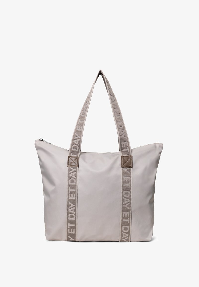 Duża beżowa torba na ramię wykonana z gładkiego materiału, z dwiema plecionymi rączkami z napisem "ET DAY" oraz zamkiem błyskawicznym u góry dla zapewnienia bezpiecznego dostępu.