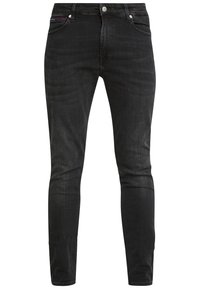 Pantalones vaqueros de mezclilla negros con corte ajustado, que cuentan con cinco bolsillos, cierre de botón en la parte delantera y una textura sutil con cintura de altura media.