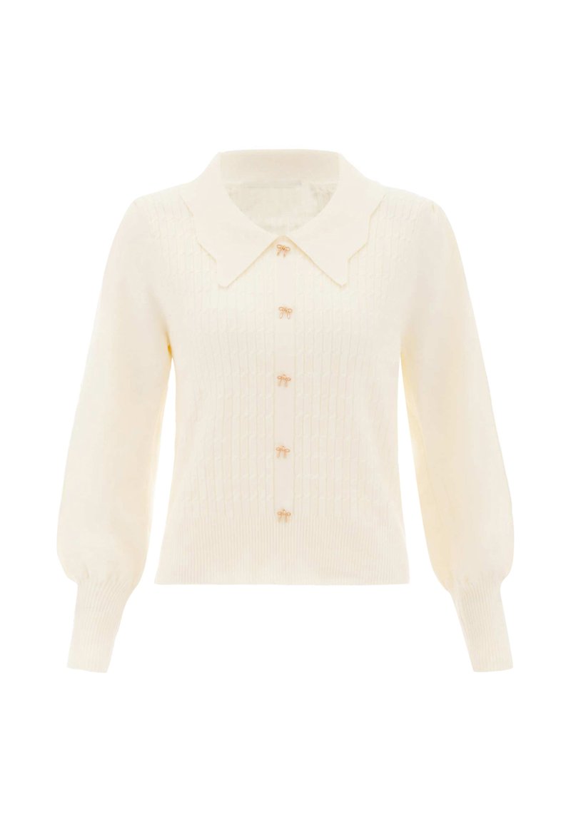 Crème gebreide cardigan met opgezette lange mouwen, gestructureerd patroon, gegolfde brede kraag en kleine strikvormige knopen aan de voorkant.