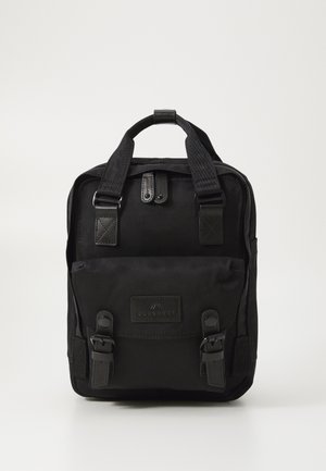 Black backpack with a rectangular shape, made of durable fabric. Features double top handles, clasp closures, and a logo patch.