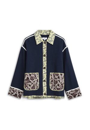 Navy jacket with paisley yellow collar, button placket, brown paisley patch pockets, and matching cuff details, white piping on shoulders and sleeves.