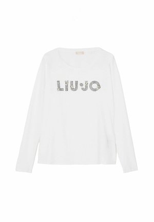 Biele tričko s dlhými rukávmi nesie nápis "LIU•JO" zo strieborných kamienkov, má okrúhly výstrih a voľný strih. Jemný bavlnený materiál.