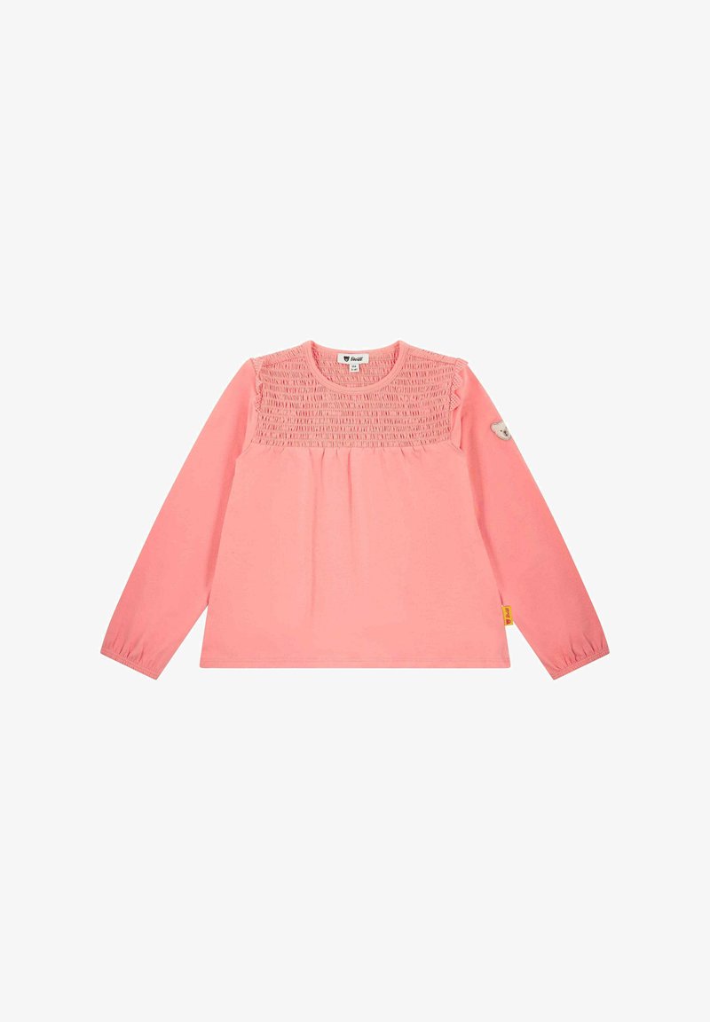 Langärmliges rosa Hemd mit gerafftem Rüschendetail an der Schulterpartie, Rundhalsausschnitt und einem kleinen Bären-Abzeichen auf dem linken Ärmel.