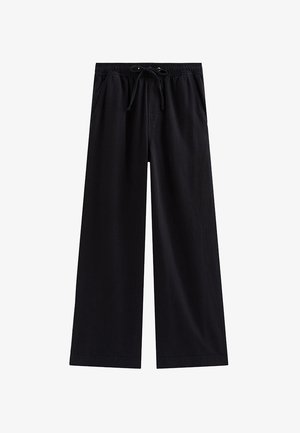 Czarne spodnie o szerokich nogawkach z elastycznym pasem i sznurkiem, wyposażone w boczne kieszenie i luźny krój.