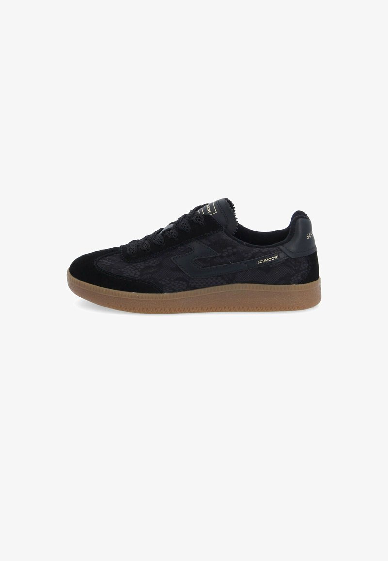 Black sneakers featuring a textured fabric upper, suede accents, and a gum rubber sole. Includes contrasting branding on the side and tongue.