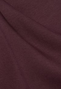 Burgundy fabric with a smooth, slightly textured surface, featuring a subtle stretch and draping quality typical of knit material.