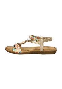 Platte sandaal met een bloemenstof bovenwerk in crème, met gevlochten details en metalen accenten. Gevoerde beige zool voor comfort.